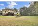 Large backyard with grassy area and elevated deck at 1661 Battalion Dr, Charleston, SC 29412