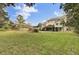 Spacious backyard with large grassy area and elevated deck at 1661 Battalion Dr, Charleston, SC 29412