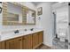 Bathroom features double sinks, wood cabinets, and a shower at 1661 Battalion Dr, Charleston, SC 29412