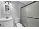 Clean bathroom with white vanity, toilet, and a glass shower at 1661 Battalion Dr, Charleston, SC 29412