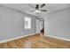 Light-filled bedroom with hardwood floors and an adjacent bathroom at 1661 Battalion Dr, Charleston, SC 29412