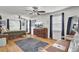 Well-lit bedroom with a comfortable bed, dresser, and a view of the upper level at 1661 Battalion Dr, Charleston, SC 29412