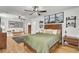 Bright bedroom featuring a wooden bed frame, decorative wall art, and hardwood floors at 1661 Battalion Dr, Charleston, SC 29412