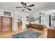 Spacious bedroom with wood floors, large windows, and a built-in dresser at 1661 Battalion Dr, Charleston, SC 29412