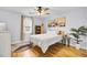 Bedroom with wood floors, ceiling fan and coastal decor at 1661 Battalion Dr, Charleston, SC 29412