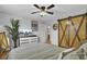 Bedroom with barn door, wood floors, and a dresser at 1661 Battalion Dr, Charleston, SC 29412