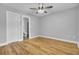 Simple bedroom with hardwood floors and an attached bathroom at 1661 Battalion Dr, Charleston, SC 29412