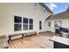 Back deck with wooden benches and a grill, adjacent to the house at 1661 Battalion Dr, Charleston, SC 29412