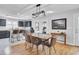 Stylish dining area with a unique epoxy table and modern chandelier at 1661 Battalion Dr, Charleston, SC 29412