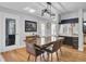 Bright dining area with hardwood floors and a large epoxy table at 1661 Battalion Dr, Charleston, SC 29412