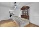 Bright dining room features hardwood floors, a long table, and a display cabinet at 1661 Battalion Dr, Charleston, SC 29412