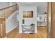 Bright entryway with hardwood floors and coastal decor at 1661 Battalion Dr, Charleston, SC 29412