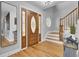 Hardwood floors, staircase, and elegant front door at 1661 Battalion Dr, Charleston, SC 29412