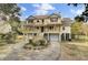 Two-story house with double garage, large porch, and landscaped yard at 1661 Battalion Dr, Charleston, SC 29412