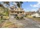 Two-story house with double garage, large porch, and landscaped yard at 1661 Battalion Dr, Charleston, SC 29412
