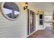 Elegant front door with sidelights and circular window at 1661 Battalion Dr, Charleston, SC 29412