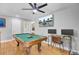 Game room includes a pool table, work area and hardwood floors at 1661 Battalion Dr, Charleston, SC 29412