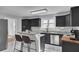 Modern kitchen with dark cabinetry, granite counters, and stainless steel appliances at 1661 Battalion Dr, Charleston, SC 29412