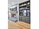 Fireplace, built-in bar, and hardwood floors in this living room at 1661 Battalion Dr, Charleston, SC 29412