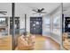 Relaxing sitting area with built-in shelving and hardwood floors at 1661 Battalion Dr, Charleston, SC 29412