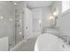 Modern bathroom featuring a freestanding tub, glass shower, and a vanity with a mirror at 1892 Grover Rd, Johns Island, SC 29455