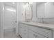 Bright bathroom featuring double sinks with modern fixtures and gray quartz countertop at 1892 Grover Rd, Johns Island, SC 29455