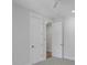 Bedroom with carpet, neutral walls, and two doors at 1892 Grover Rd, Johns Island, SC 29455