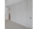 Neutral carpeted bedroom with white walls and trim and an open doorway to the hallway at 1892 Grover Rd, Johns Island, SC 29455