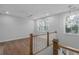 Bonus room with hardwood floors, a white ceiling fan, and two large windows at 1892 Grover Rd, Johns Island, SC 29455