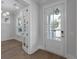 Bright entryway with white trim, wood floors, and a glass front door at 1892 Grover Rd, Johns Island, SC 29455