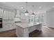 Modern kitchen with a large island and stainless steel appliances at 1892 Grover Rd, Johns Island, SC 29455