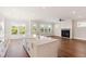 Spacious living area featuring hardwood floors and a fireplace at 1892 Grover Rd, Johns Island, SC 29455