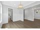 Open-concept living room with wood floors and wainscoting at 1892 Grover Rd, Johns Island, SC 29455