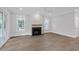 Modern living room featuring a fireplace, natural light, and neutral finishes at 1892 Grover Rd, Johns Island, SC 29455