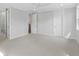 Spacious main bedroom featuring neutral carpet, white trim, and ensuite bathroom access at 1892 Grover Rd, Johns Island, SC 29455