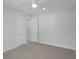 Bright bedroom featuring a ceiling fan, neutral carpet, and white doors at 1894 Grover Rd, Johns Island, SC 29455