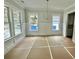 Spacious dining room with wainscoting and large windows at 1894 Grover Rd, Johns Island, SC 29455