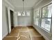 Bright dining room with large windows and chandelier at 1894 Grover Rd, Johns Island, SC 29455
