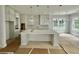 Large kitchen island and white cabinetry at 1894 Grover Rd, Johns Island, SC 29455