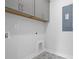 Laundry room featuring grey cabinets and unique tile flooring and ample storage at 1894 Grover Rd, Johns Island, SC 29455