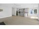 Open floor plan living room and kitchen with stainless appliances, gray cabinets, and large island at 1894 Grover Rd, Johns Island, SC 29455