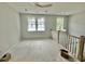 Spacious loft area with two windows and a staircase at 1894 Grover Rd, Johns Island, SC 29455