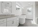 Bright bathroom with freestanding tub, double vanity, walk-in shower, and tile floors at 1894 Grover Rd, Johns Island, SC 29455