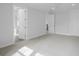 Spacious main bedroom featuring neutral carpet, white trim, and ensuite bathroom at 1894 Grover Rd, Johns Island, SC 29455