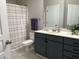 Bathroom boasts a dark vanity, shower, and tile floor at 1908 Basildon Rd, Mount Pleasant, SC 29466
