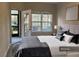 Main bedroom with king bed, window, and access to patio at 1908 Basildon Rd, Mount Pleasant, SC 29466