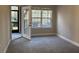 Bedroom with patio access, window, and neutral carpet at 1908 Basildon Rd, Mount Pleasant, SC 29466