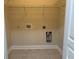 Bright laundry room with built-in shelving at 1908 Basildon Rd, Mount Pleasant, SC 29466