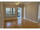 Light-filled living room with hardwood floors and access to patio at 1908 Basildon Rd, Mount Pleasant, SC 29466