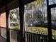 Screened porch overlooking community parking and trees at 1908 Basildon Rd, Mount Pleasant, SC 29466